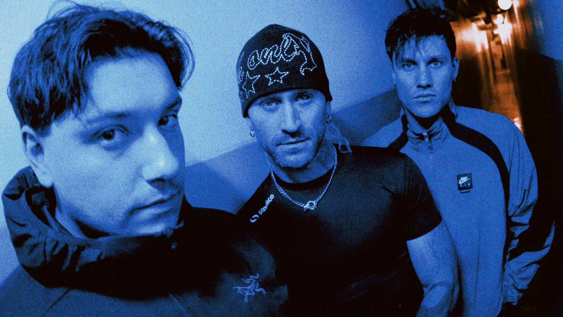 The three members of Ocean Grove photographed in blue light.