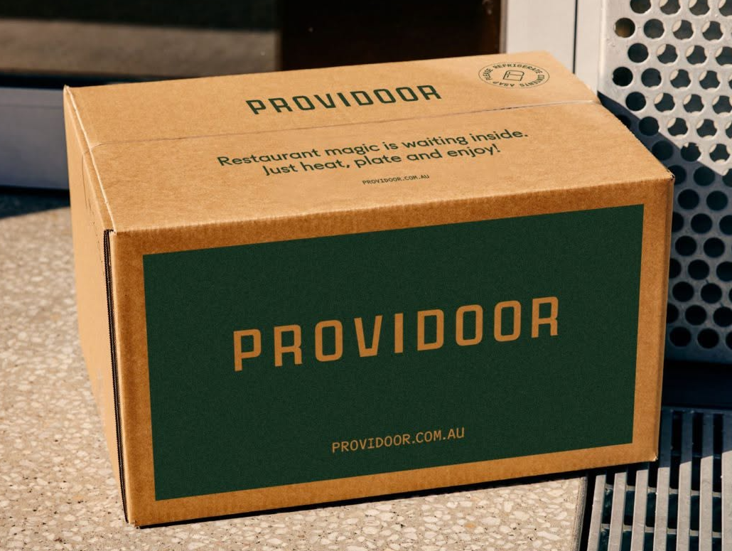 A brown Providoor-branded delivery box on a kitchen counter.